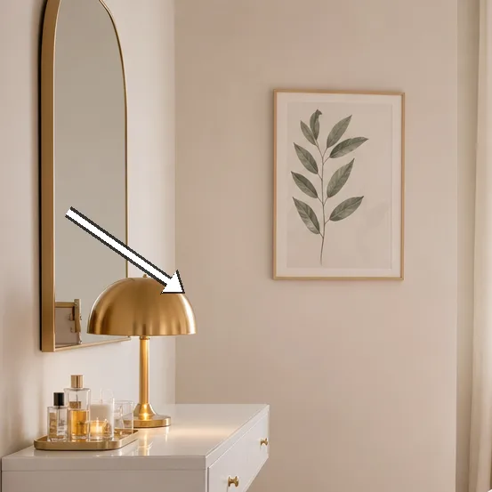 Mounted vanity desk with a mirror and brass lamp.