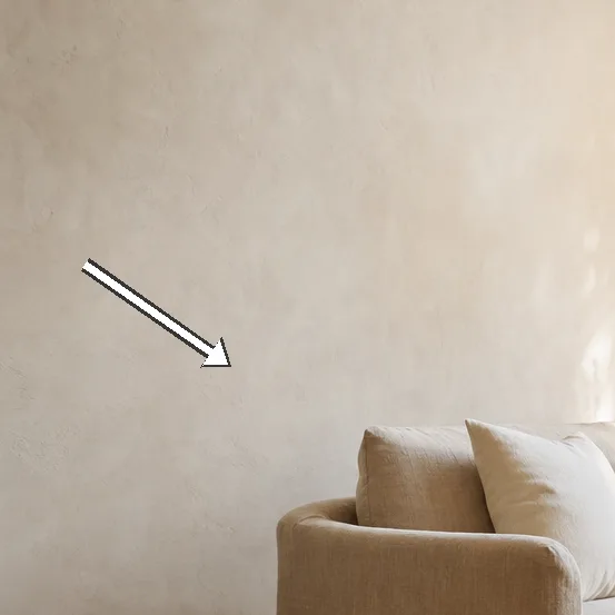 Detail of the warm white wall texture in matte limewash