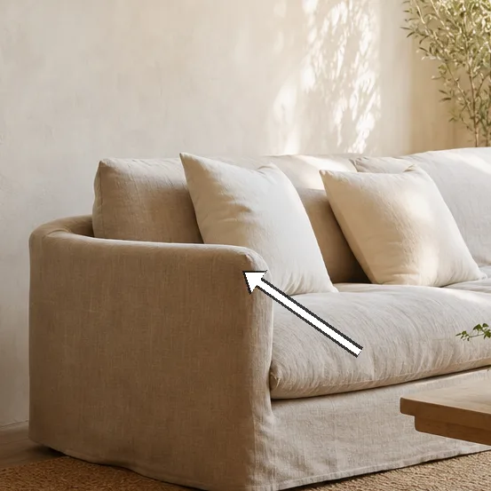 Morning light on flax-linen sofa and neutral cushions